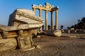 A ruined Roman entrance to the Temple of Apollo under a bright blue sky at sunrise, Side, Turkey A ruined Roman entrance to the Temple of Apollo under a bright blue sky at sunrise, Side, Turkey