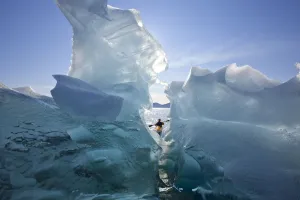 Sea Kayaker Views Large Icebergs In Stephens Passage On A Warm Summer Afternoon Sea Kayaker Views Large Icebergs In Stephens Passage On A Warm Summer Afternoon