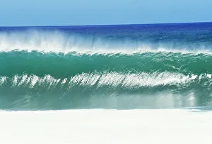 Shimmery Shorebreak Wave With Silver Waters In Foreground Shimmery Shorebreak Wave With Silver Waters In Foreground