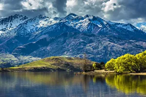 Shoreline of lake and mountain range at Glendhu Bay in the Otago Region of New Zealand Shoreline of lake and mountain range at Glendhu Bay in the Otago Region of New Zealand