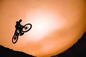 Images Dated 13th August 2005: Silhouette Of Stunt Cyclist