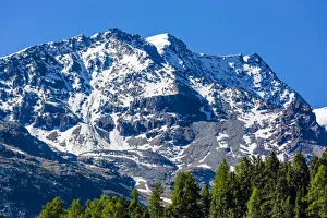 Snow covered mountain top at St Moritz on a sunny day, Switzerland Snow covered mountain top at St Moritz on a sunny day, Switzerland