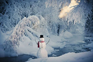 Snowman Standing Next To A Stream With Fog And Hoar Frosted Trees In The Background, Russian Jack Springs Park