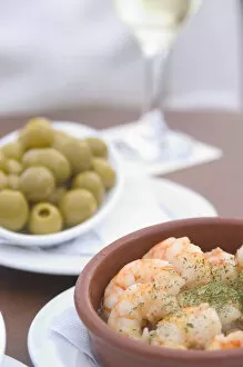 Images Dated 22nd May 2005: Spain, Tapas (olives and prawns) with glass of wine; Barcelona