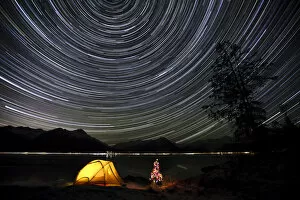 Mud Flats Gallery: Star Trails Circle Above The Chugach Mountains With A Backpacking Tent And Christmas Tree Along