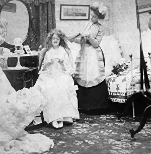 Stereoview card from circa 1900 for viewing thought a stereoscope. A bride in her bedroom having her hair brushed prior Stereoview card from circa 1900 for viewing thought a stereoscope. A bride in her bedroom having her hair brushed prior