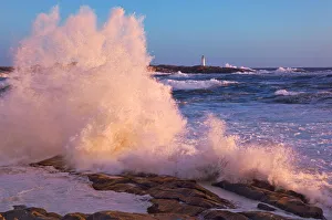 Strong Winds Blow Waves Onto Rocks In Front Of Lighthouse At Peggy's Cove, Nova Scotia Strong Winds Blow Waves Onto Rocks In Front Of Lighthouse At Peggy's Cove, Nova Scotia