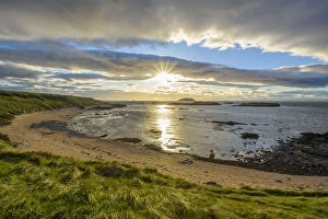 East Lothian Gallery: Sun shining over bay with sandy beach at sunset in North Berwick at Firth of Forth in Scotland