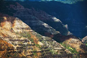 Sunlight Brightens The Slopes Of The Canyons In Waimea Canyon State Park; Kauai, Hawaii, United States Of America Sunlight Brightens The Slopes Of The Canyons In Waimea Canyon State Park; Kauai, Hawaii, United States Of America