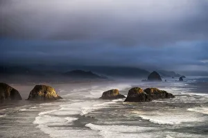 Sunlight And Mist Create Coastal Moods; Cannon Beach, Oregon, United States Of America Sunlight And Mist Create Coastal Moods; Cannon Beach, Oregon, United States Of America