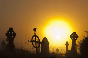 Sunrise at aghadoe heights graveyard with silhouetted tombstones; Killarney, county kerry, ireland Sunrise at aghadoe heights graveyard with silhouetted tombstones; Killarney, county kerry, ireland