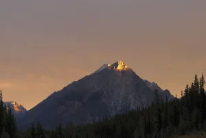 Sunrise Lights Up A Mountain Peak; Alberta, Canada Sunrise Lights Up A Mountain Peak; Alberta, Canada