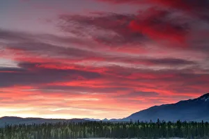 Sunset Over Mountains Along The Alaska Highway Outside Whitehorse, Yukon Sunset Over Mountains Along The Alaska Highway Outside Whitehorse, Yukon