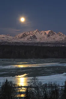 Super Moon As It Descended Over The Denali Range And Chulitna River, Along The Parks Highway; Trapper Creek, Alaska Super Moon As It Descended Over The Denali Range And Chulitna River, Along The Parks Highway; Trapper Creek, Alaska
