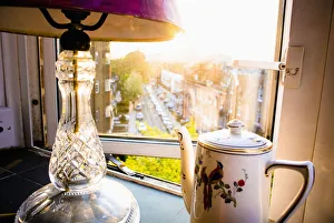 Teapot And Lamp On Windowsill In Afternoon Sun, Baron's Court; West London, England Teapot And Lamp On Windowsill In Afternoon Sun, Baron's Court; West London, England