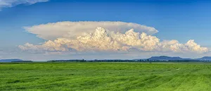 Thundercloud (cumulonimbus) over green field. Bavaria, Germany Thundercloud (cumulonimbus) over green field. Bavaria, Germany