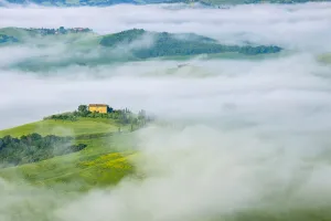 Typical Tuscany landscape with farm in morning with fog near Pienza. Pienza, Siena district, Tuscany, Toscana, Italy Typical Tuscany landscape with farm in morning with fog near Pienza. Pienza, Siena district, Tuscany, Toscana, Italy