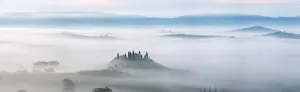 Typical Tuscany landscape in morning with fog, in foreground is Podere Belvedere a farm near San Quirico d'Orcia Typical Tuscany landscape in morning with fog, in foreground is Podere Belvedere a farm near San Quirico d'Orcia