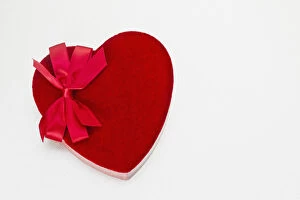 Valentines heart-shaped candy box against white background
