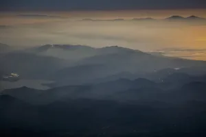 View Of Mountains And Clouds At Sunset Along The Coastline; Greece View Of Mountains And Clouds At Sunset Along The Coastline; Greece