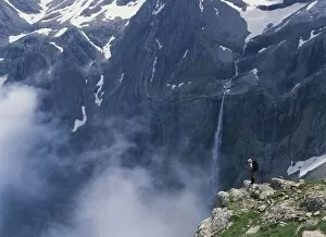 Backpackers Collection: Walker Looking Over Waterfall At Cirque De Gavarnie