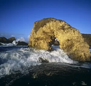 Images Dated 20th March 2007: Wave Splashing Against Natural Arch, Antrim Coast, County Antrim, Northern Ireland