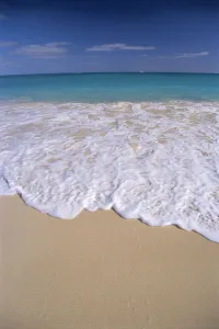Whitewash Breaking Along Shoreline, Turquoise Water, Blue Sky On Horizon Whitewash Breaking Along Shoreline, Turquoise Water, Blue Sky On Horizon