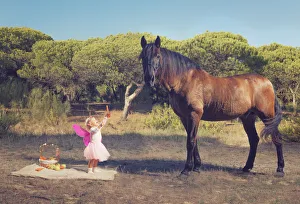 Young Girl With Pink Ferry Wings And A Brown Horse; Tarifa, Cadiz, Andalusia, Spain Young Girl With Pink Ferry Wings And A Brown Horse; Tarifa, Cadiz, Andalusia, Spain