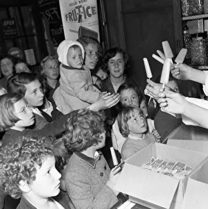 1000 ice lollies are given away free by sweet shop owner Mr H C Downey 1000 ice lollies are given away free by sweet shop owner Mr H C Downey