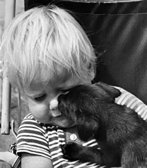 Images Dated 22nd July 1973: 2 year old Jason Swain, of Erith, Kent, was given his first puppy