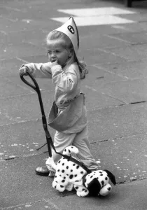 2 year old Thea Behbahani tries out a new plastic trike and nodding dog 2 year old Thea Behbahani tries out a new plastic trike and nodding dog