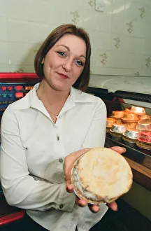 21 year old barmaid Sarah Pilcher holds up a steak and kidney pie in a fish and chip shop 21 year old barmaid Sarah Pilcher holds up a steak and kidney pie in a fish and chip shop