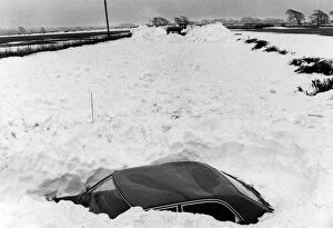 Images Dated 23rd February 1978: Abandoned car lies in the path of the snow clearing machines working between Llantwit