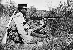 Abyssinian War September 1935 Abyssinian machine gunner firing an old Hotchkiss Abyssinian War September 1935 Abyssinian machine gunner firing an old Hotchkiss