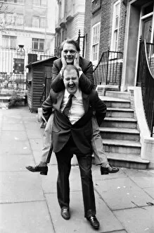 Images Dated 16th February 1986: Actor David Jason (Only Fools and Horses) on the back of Gordon Kaye ( Allo