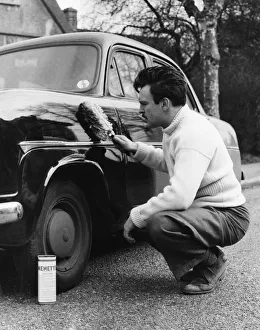 Actor Donald Sinden seen here polishing his Ford Consul. Circa February 1955 Actor Donald Sinden seen here polishing his Ford Consul. Circa February 1955