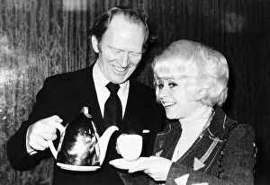 Actor Gordon Jackson pours tea for Barbara Windsor 1976