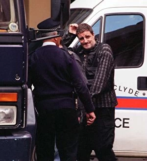 Images Dated 13th May 1997: Actor Iain McColl is led away from court into a police van after he was remanded in