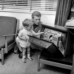 Televison Gallery: Actor Johnny Briggs at home with his son Mark. Circa 1963