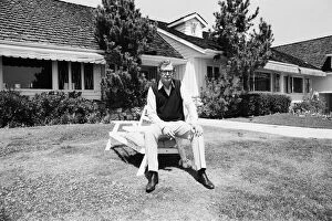 Images Dated 15th April 1984: Actor Michael Caine relaxes outside his home in California, USA. 15th April 1984