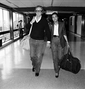 Images Dated 31st May 1983: Actor Michael Caine and his wife Shakira arriving at Heathrow Airport from Barbados