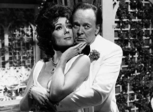 Actress Diana Rigg with Tony Britten playing the parts of Elizabeth Taylor Actress Diana Rigg with Tony Britten playing the parts of Elizabeth Taylor