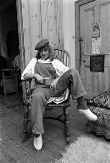 Images Dated 16th February 1977: Actress Helen Mirren seated in her country Windsor chair wearing her favorite cap