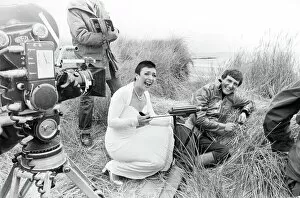 January Collection: Actress Jacqueline Pearce as Servalan and Paul Darrow as Avon share a joke during filming