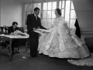 Actress Julie Andrews trying on a dress for her role in the pantomime Cinderella' Actress Julie Andrews trying on a dress for her role in the pantomime Cinderella'