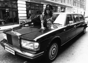 Boots And Shoes Gallery: Actress Kate O Mara on the bonnet of a Rolls Royce October 1987 Of Dynasty