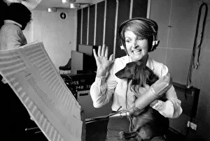 Images Dated 12th June 1980: Actress Penelope Keith makes a record about a Dachsund dog. June 1980 80-03067-005