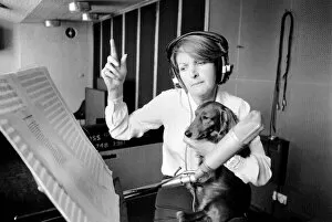 Images Dated 12th June 1980: Actress Penelope Keith makes a record about a Dachsund dog. June 1980 80-03067-003
