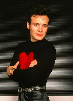 Adam Ant pop singer January 1990 Arms folded black jumper red heart - Stuart Adam Ant pop singer January 1990 Arms folded black jumper red heart - Stuart