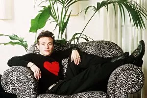 Images Dated 4th February 1990: Adam Ant singer sits in chair - Stuart Goddard